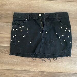 Black denim mini skirt with pearl and gem detailing